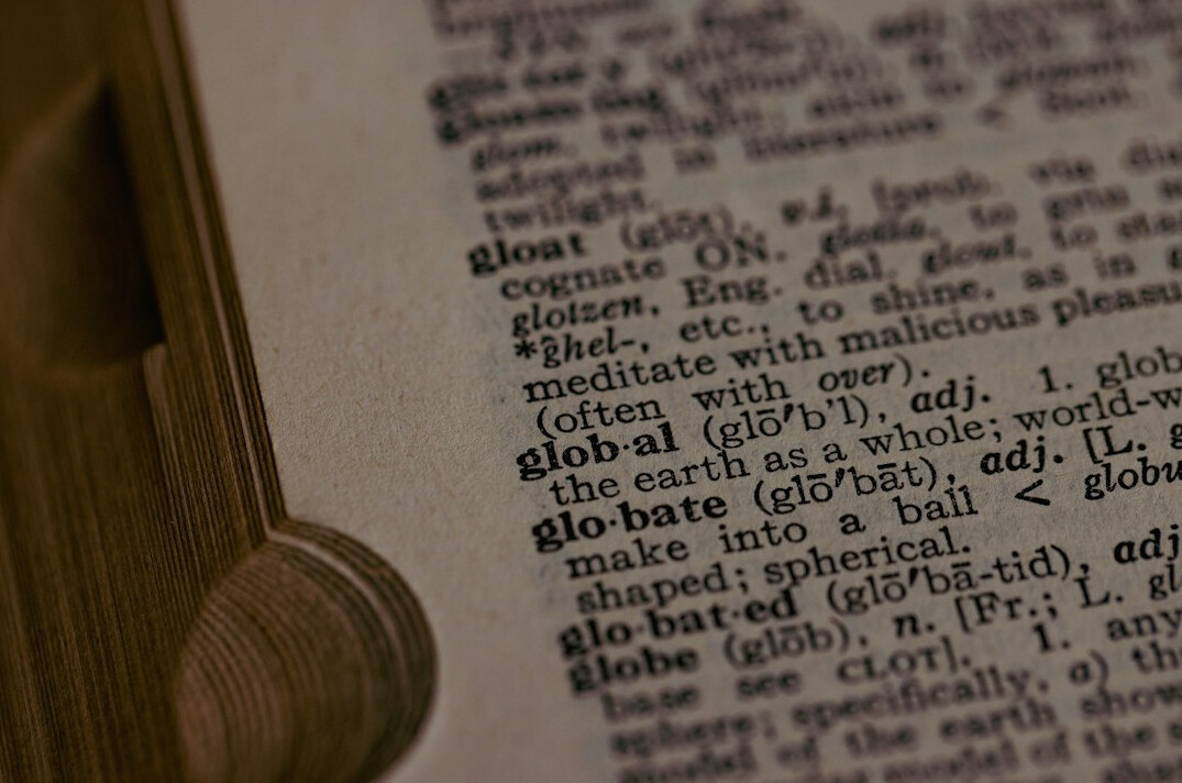 Magnifying glass over a printed document highlighting text