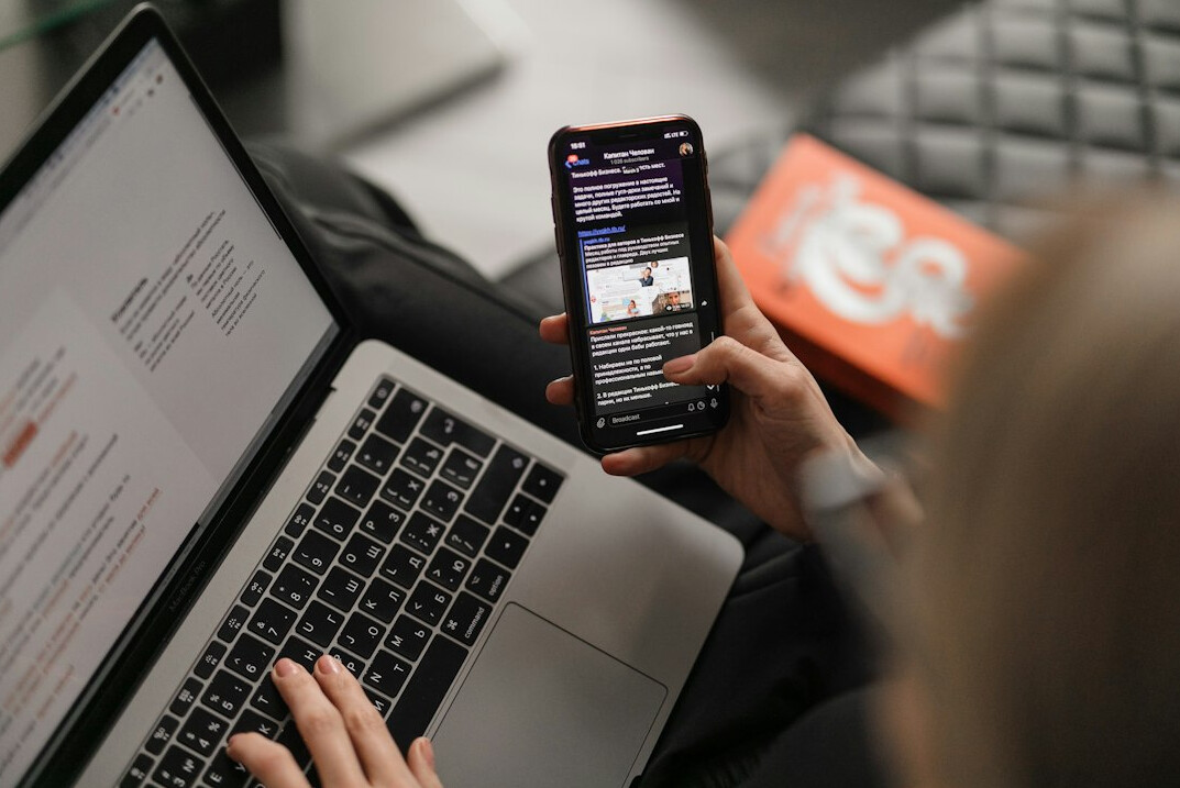 person reading news on phone